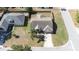 Aerial view of a home on a corner lot with long driveway at 633 Heather Glen Loop, Winter Haven, FL 33884