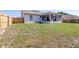 Large, level backyard featuring a grassy area and privacy fence, perfect for outdoor activities and entertaining at 633 Heather Glen Loop, Winter Haven, FL 33884