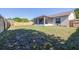 Spacious backyard with a wood fence and covered, screened porch at 633 Heather Glen Loop, Winter Haven, FL 33884