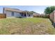 Large backyard with a screen enclosed porch and wood fence at 633 Heather Glen Loop, Winter Haven, FL 33884