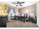 Bright bedroom featuring a loft bed, ceiling fan, and charming decor perfect for a space at 633 Heather Glen Loop, Winter Haven, FL 33884