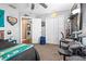 Spacious bedroom showcasing carpet floors, ceiling fan, a closet, and a laundry area, providing comfort and convenience at 633 Heather Glen Loop, Winter Haven, FL 33884