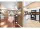 Open-concept kitchen view into the living room with hardwood floors and sliding glass doors to the lanai at 633 Heather Glen Loop, Winter Haven, FL 33884