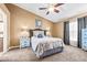 Inviting main bedroom with a comfortable bed, neutral decor, carpeted flooring, and natural light at 633 Heather Glen Loop, Winter Haven, FL 33884
