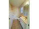 Cozy bathroom with tile floors, a single vanity, and a shower-tub combo at 668 Jamaica Cir, Lakeland, FL 33803