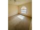 Bright bedroom features neutral walls, carpet, a ceiling fan and a window at 668 Jamaica Cir, Lakeland, FL 33803