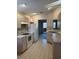 Bright kitchen with white appliances, light countertops, and ample cabinet space at 668 Jamaica Cir, Lakeland, FL 33803