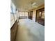 Enclosed patio with brick accents, multiple ceiling fans, and tiled flooring, ideal for relaxation at 668 Jamaica Cir, Lakeland, FL 33803