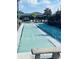 Community shuffleboard courts surrounded by manicured landscaping and walkways at 668 Jamaica Cir, Lakeland, FL 33803
