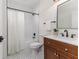 Bathroom features white subway tile, dark fixtures, and patterned tile floor at 737 Johnson Ave, Lakeland, FL 33801