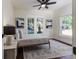 Bedroom features a ceiling fan, decorative rug, and abundant natural light at 737 Johnson Ave, Lakeland, FL 33801