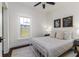 Sunny bedroom with large window and a cozy white metal frame bed at 737 Johnson Ave, Lakeland, FL 33801