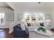 Bright living room showcases hardwood floors, neutral décor, and a large window, complemented by artwork at 737 Johnson Ave, Lakeland, FL 33801