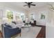 Inviting living room with ample natural light, hardwood floors, and comfortable seating near front door at 737 Johnson Ave, Lakeland, FL 33801
