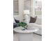 Cozy living room features an abundance of natural light, a comfortable white sofa, and modern side tables at 737 Johnson Ave, Lakeland, FL 33801