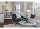 Open-concept living room showcases elegant decor, hardwood floors, neutral paint, and seamless flow into the dining area at 737 Johnson Ave, Lakeland, FL 33801