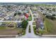 Aerial view of a residential neighborhood featuring well-maintained homes, mature trees, and landscaped yards at 7890 Ashford Dr, Lakeland, FL 33810