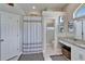 Neat bathroom showcasing a shower, vanity area, and adjacent toilet room, all with clean, modern finishes at 7890 Ashford Dr, Lakeland, FL 33810