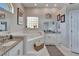 Bright bathroom with dual vanities, a soaking tub, and modern fixtures, providing a spa-like experience at 7890 Ashford Dr, Lakeland, FL 33810