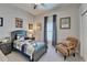 Comfortable ' bedroom with a cozy chair, neutral walls, and a window for natural light, perfect for a space at 7890 Ashford Dr, Lakeland, FL 33810
