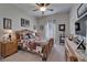 Cozy bedroom with a decorative quilt on a wood bed frame, with a ceiling fan and two dressers for storage at 7890 Ashford Dr, Lakeland, FL 33810