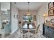 Cozy dining area with a view of the pool, illuminated by a stylish pendant light at 7890 Ashford Dr, Lakeland, FL 33810