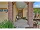Charming front entrance with brick columns, manicured landscaping, and a welcoming front door at 7890 Ashford Dr, Lakeland, FL 33810