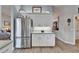 Modern kitchen with stainless steel refrigerator, granite countertops, and sleek cabinetry at 7890 Ashford Dr, Lakeland, FL 33810