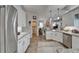 Contemporary kitchen open to living area, showcasing stainless steel appliances and cabinetry at 7890 Ashford Dr, Lakeland, FL 33810
