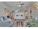 Spacious living room with ample seating, natural light, and stylish décor, perfect for entertaining at 7890 Ashford Dr, Lakeland, FL 33810