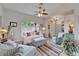 Inviting living room with a cozy seating arrangement, ceiling fan, and natural light from shuttered windows at 7890 Ashford Dr, Lakeland, FL 33810