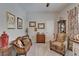 Cozy living room featuring patterned furniture, neutral walls, and decorative accents, perfect for relaxing and entertaining at 7890 Ashford Dr, Lakeland, FL 33810
