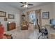 Office space with large window, wood desk, and wood dresser offers a quiet and functional workspace at 7890 Ashford Dr, Lakeland, FL 33810