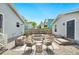 Backyard featuring a stylish outdoor lounge area with patio furniture, pavers, and a partial fence for privacy at 807 Osceola St, Lakeland, FL 33801