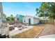 Backyard with brick pavers, patio furniture, partial fence, and low maintenance landscaping at 807 Osceola St, Lakeland, FL 33801
