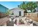 Backyard patio boasts comfortable outdoor seating, perfect for relaxation and entertaining at 807 Osceola St, Lakeland, FL 33801