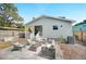 Inviting backyard patio with comfortable seating, lush landscaping, and a charming exterior at 807 Osceola St, Lakeland, FL 33801