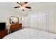 Bedroom featuring a ceiling fan, dresser, mirror, and double-door closet at 807 Osceola St, Lakeland, FL 33801