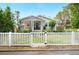 Charming home featuring a white picket fence and a welcoming front porch at 807 Osceola St, Lakeland, FL 33801