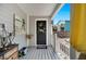 Charming front porch with a decorated front door, artistic decor, and a stylish welcome mat at 807 Osceola St, Lakeland, FL 33801