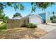 Exterior view of the detached garage and driveway, highlighting the home's parking at 807 Osceola St, Lakeland, FL 33801