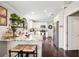 Beautiful kitchen featuring white cabinets, granite countertops, stainless steel appliances, and hardwood floors at 807 Osceola St, Lakeland, FL 33801