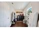 Laundry room with dark floors, utility sink, washer and dryer, and folding rack near a bright window at 807 Osceola St, Lakeland, FL 33801