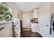 The laundry room has overhead cabinets, a window, and folding space, with a door to the backyard at 807 Osceola St, Lakeland, FL 33801