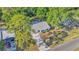 Aerial view of property nestled among mature landscaping at 819 Swann Dr, Lakeland, FL 33809