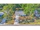 Aerial view of property with long driveway and surrounding trees at 819 Swann Dr, Lakeland, FL 33809