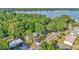 Aerial view showcasing the home's proximity to a beautiful lake and the surrounding lush, green neighborhood at 819 Swann Dr, Lakeland, FL 33809