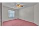 Cozy bedroom with natural light from one window and neutral color palette at 819 Swann Dr, Lakeland, FL 33809