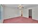 Bedroom featuring a ceiling fan, and two entryways at 819 Swann Dr, Lakeland, FL 33809