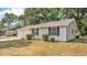 A charming home featuring durable siding and complementary shutters at 819 Swann Dr, Lakeland, FL 33809